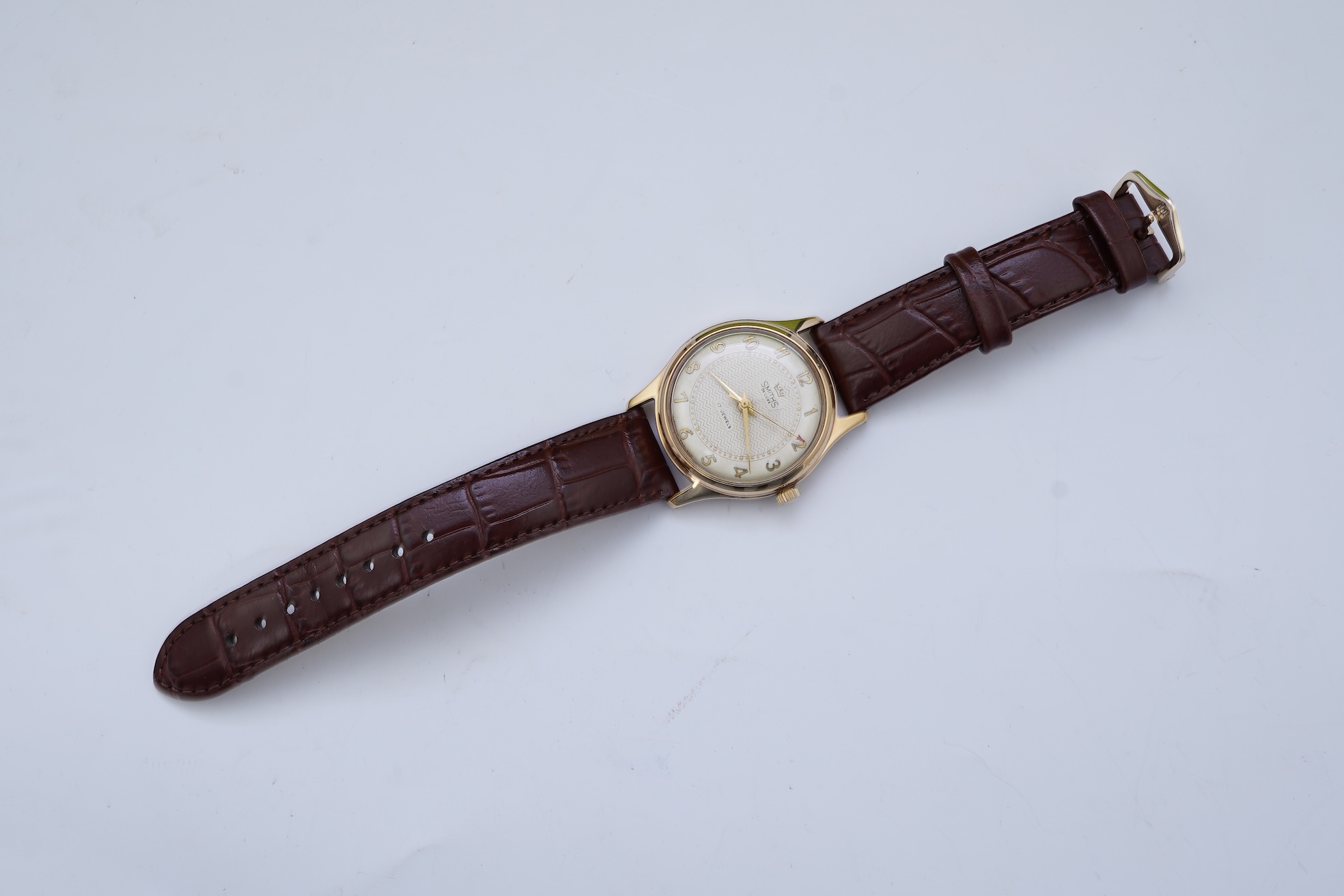 A gentleman's early 1960's 9ct gold Smiths De Luxe manual wind wrist watch